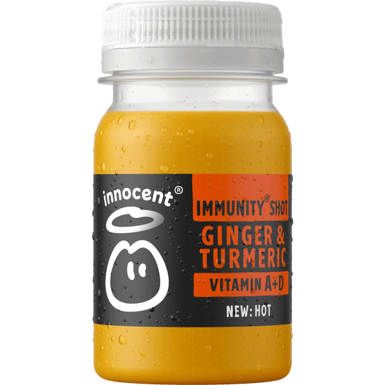 Foto van Innocent Hot ginger & tumeric shot op witte achtergrond